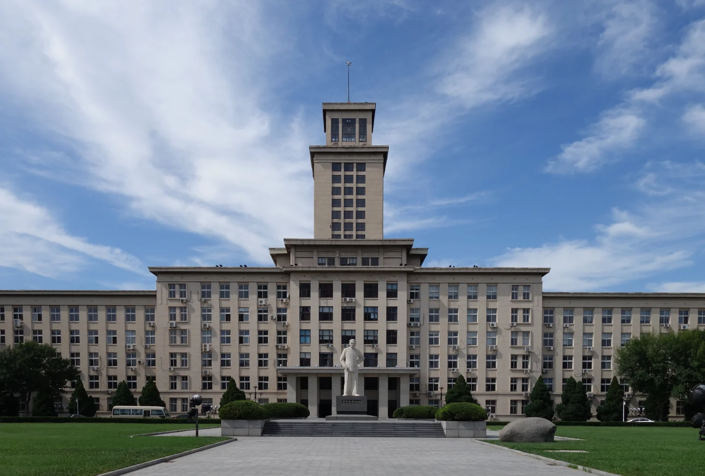 The main building at Nankai University beneath a blue sky in Tianjin.