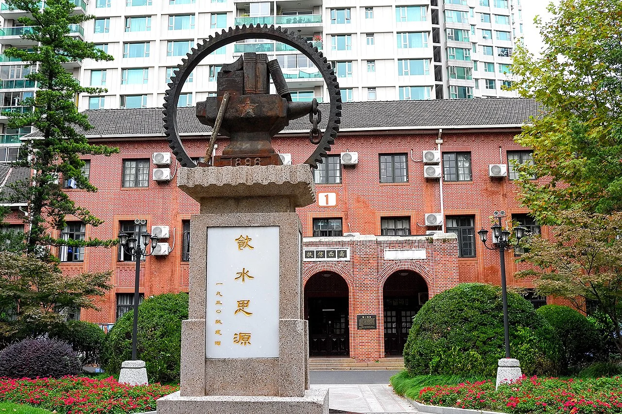 Campus monument and historic red brick building at Shanghai Jiao Tong University Xuhui Campus