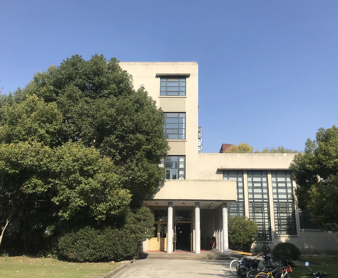 Wenyuan Building, framed by trees, on Tongji University's Siping Road campus in Shanghai.
